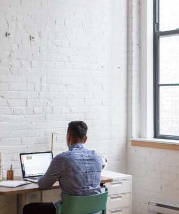 An office worker at the computer desk